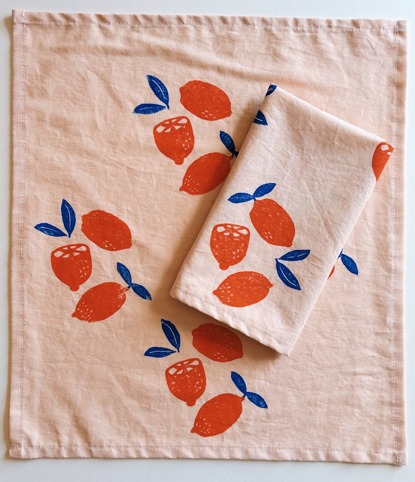 Oranges on Blush Dinner Napkins