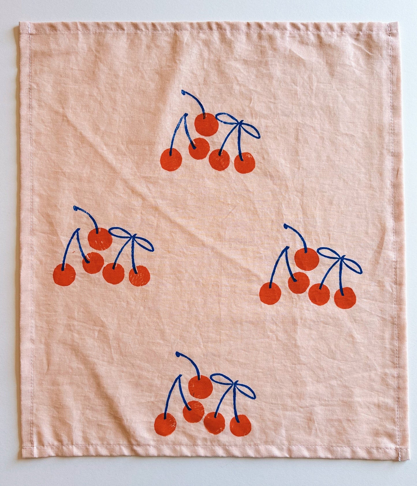 Orange Cherry on Blush Dinner Napkins