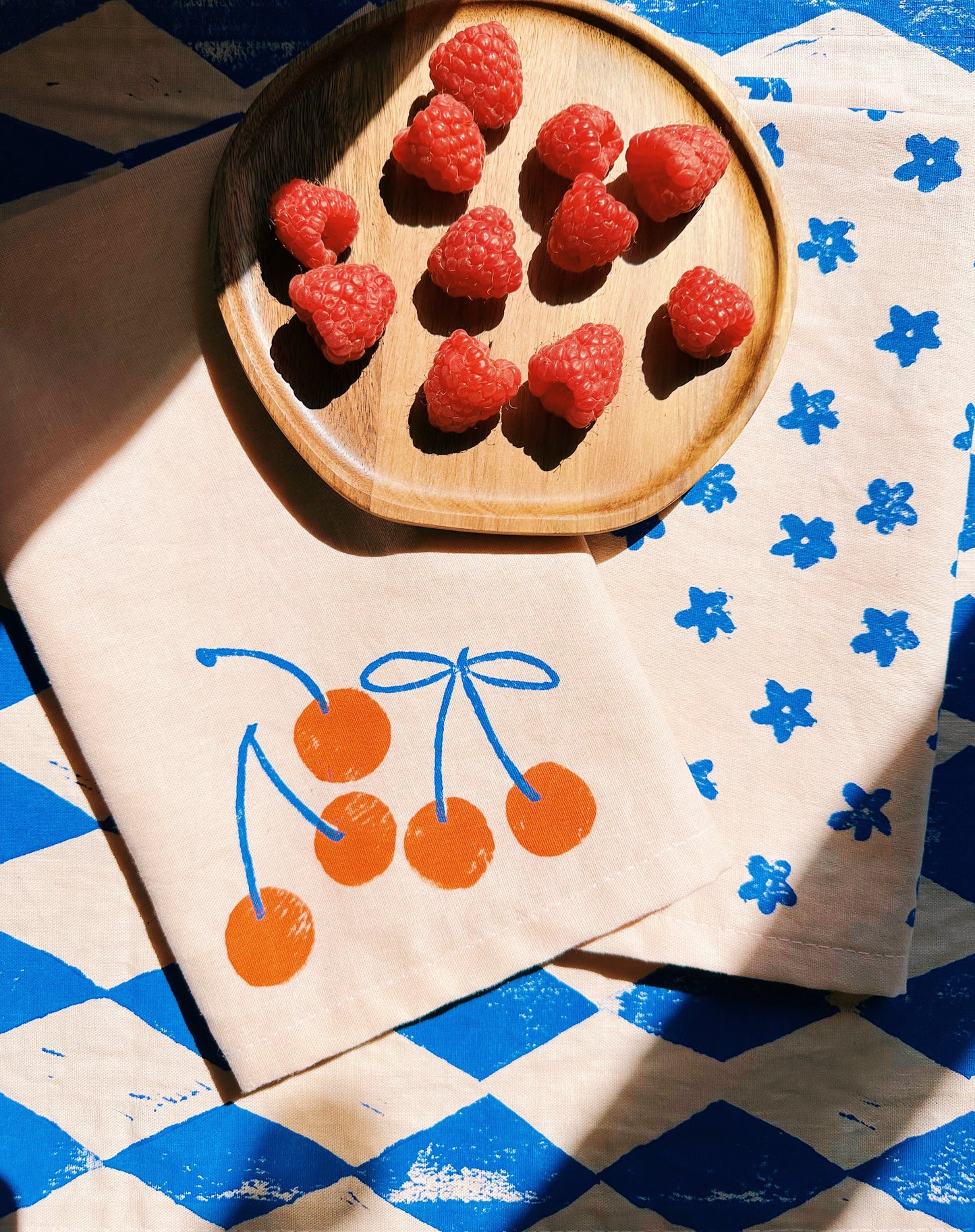Orange Cherry on Blush Dinner Napkins