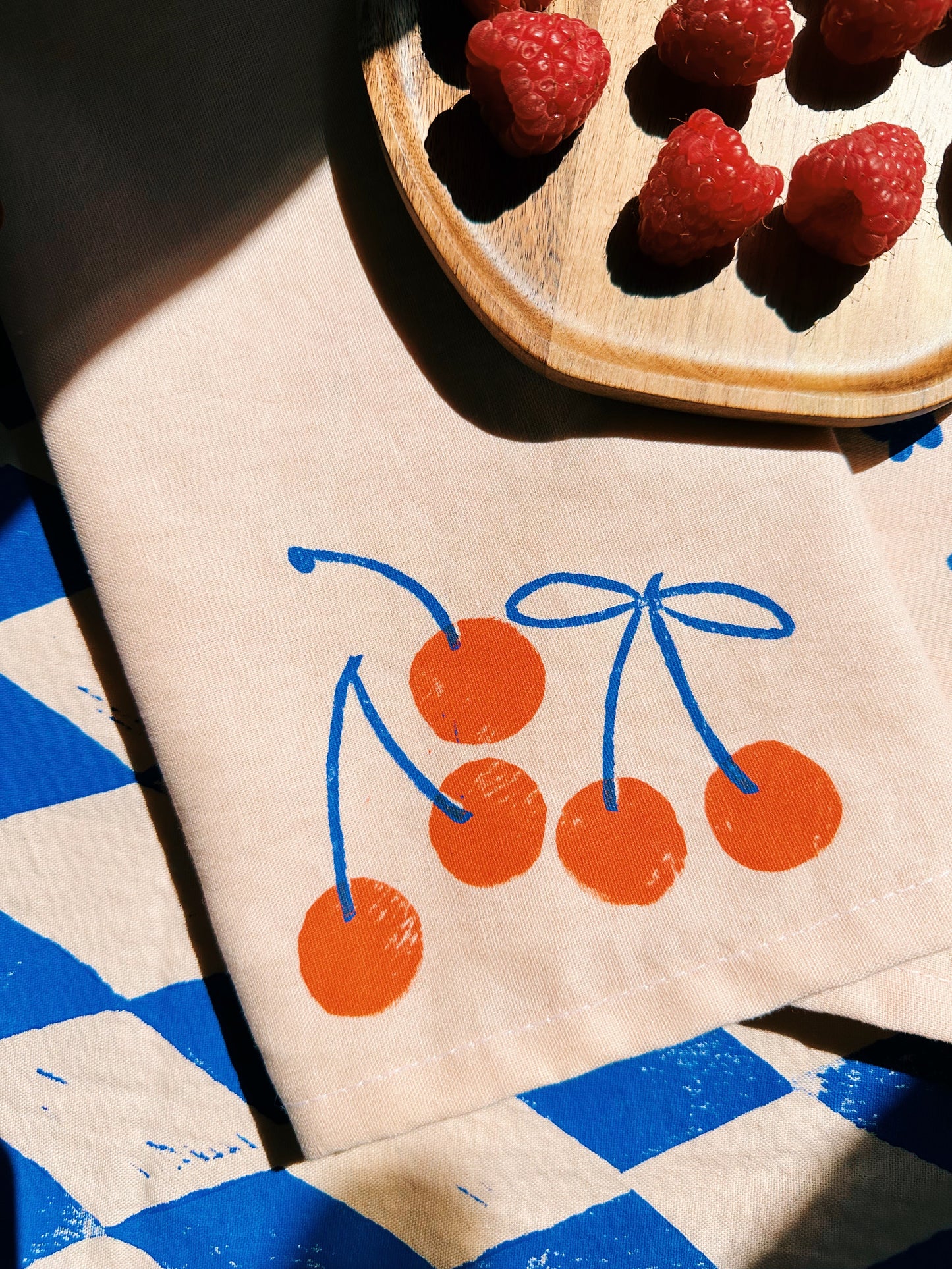 Orange Cherry on Blush Dinner Napkins