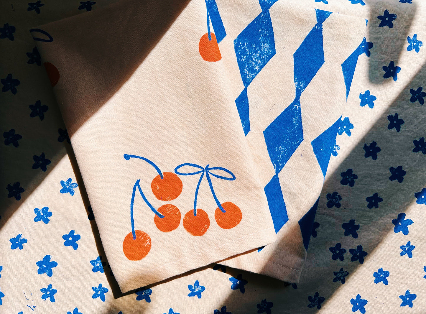 Orange Cherry on Blush Dinner Napkins